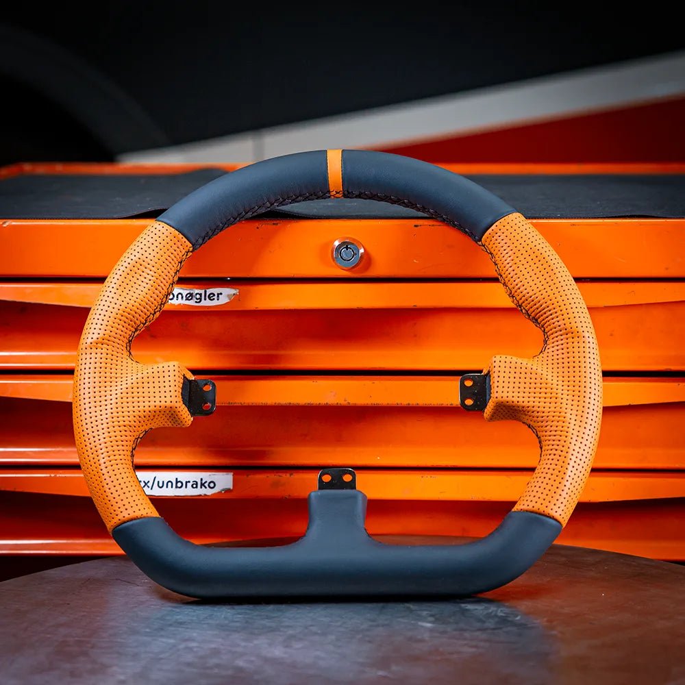 Asetek Closed D Orange Leather | Steering wheels | SIMHUB.PRO